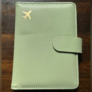 Sage green passport holder in faux leather